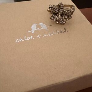 Heidi Daus  Gold Bow Ring with Clear Crystals
Size 9
B2